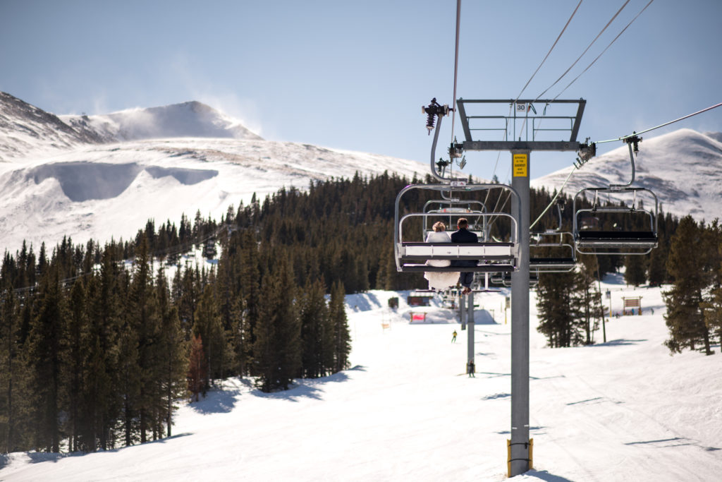 Activity ideas for your Breckenridge elopement, including riding a chairlift to the top of a mountain at a ski resort wedding venue.