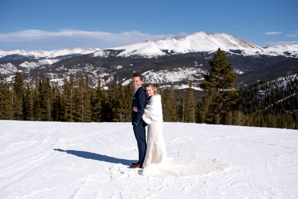 Couple on the top of the mountain at Breckenridge Ski Resort during their Colorado winter elopement in Breckenridge