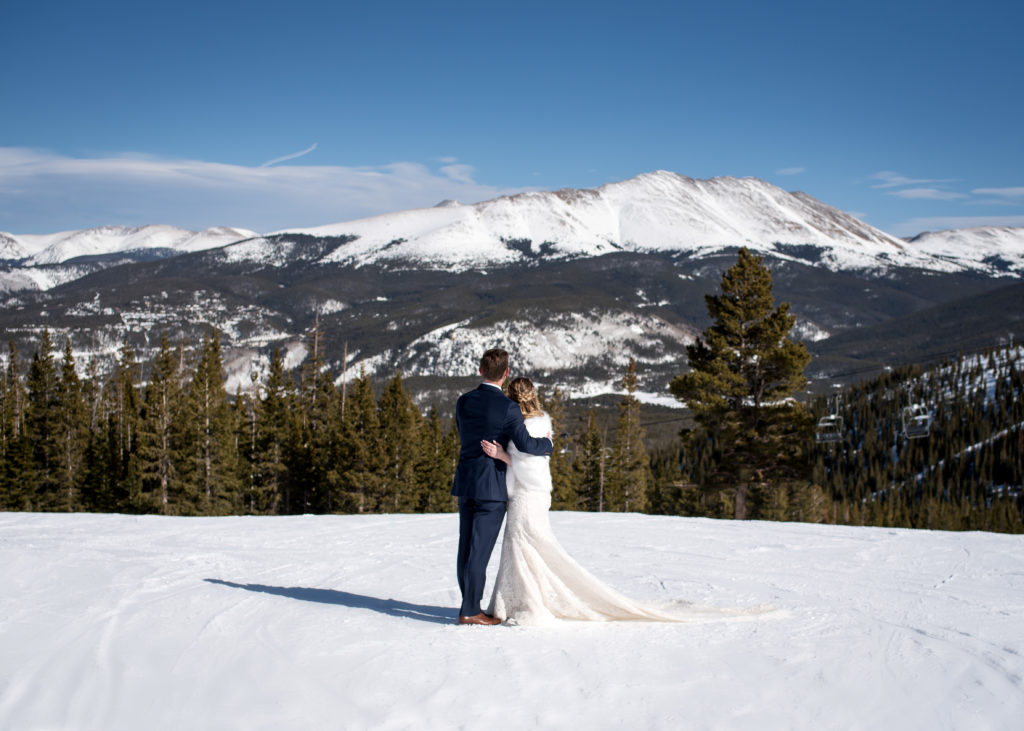 Couple looking out at Colorado mountain during Breckenridge winter elopement day 