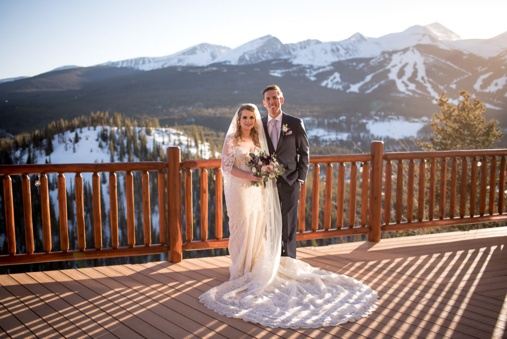 Bride and groom sunset wedding portraits on the deck at The Lodge at Breckenridge in Breckenridge, Colorado