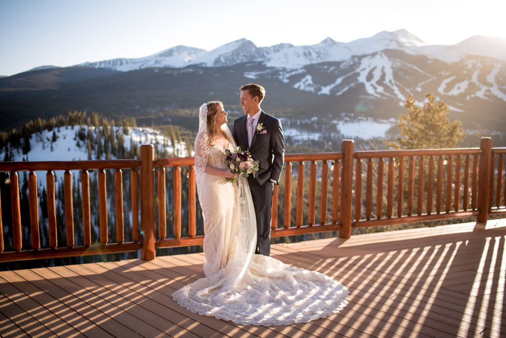 Wedding portraits on the deck at sunset at The Lodge at Breckenridge in Breckenridge, Colorado