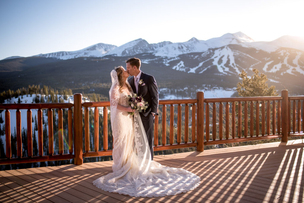 Wedding portraits on the deck at sunset at The Lodge at Breckenridge in Breckenridge, Colorado