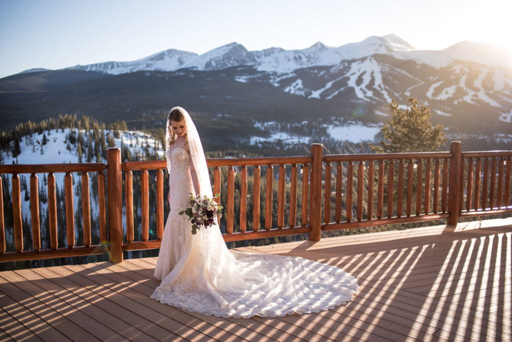The bride at sunset at The Lodge at Breckenridge during a winter Colorado wedding in Breckenridge