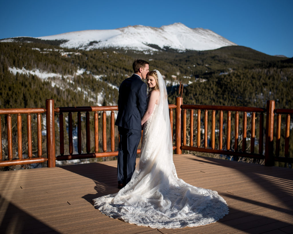 Sunny winter wedding portraits in the mountains at The Lodge at Breckenridge in Breckenridge, Colorado 