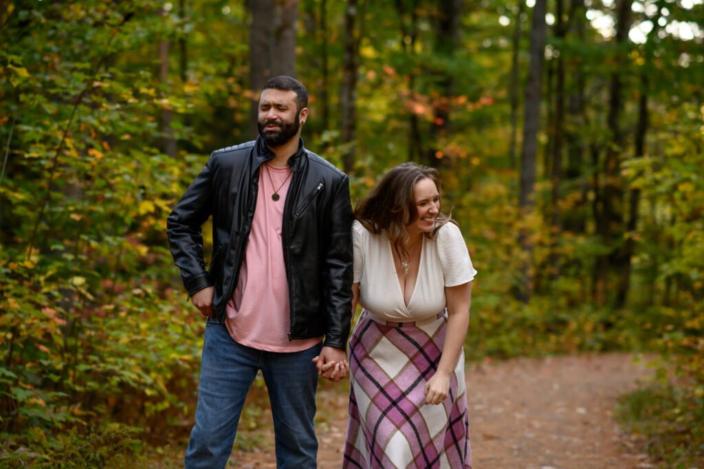 Couple laughing while holding hands
