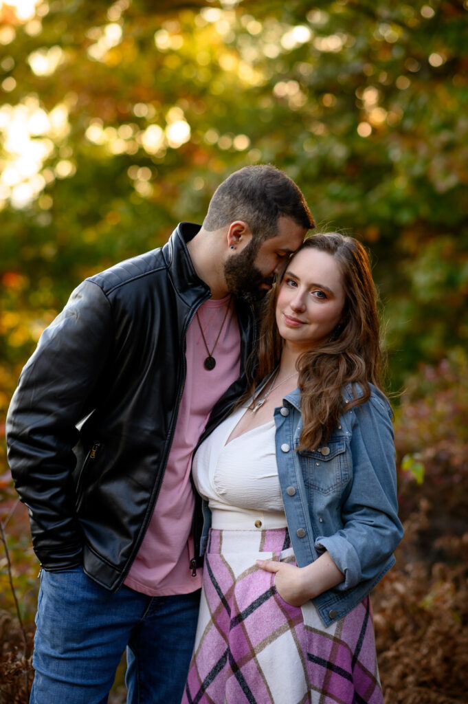 Close up up couple with forehead on temple