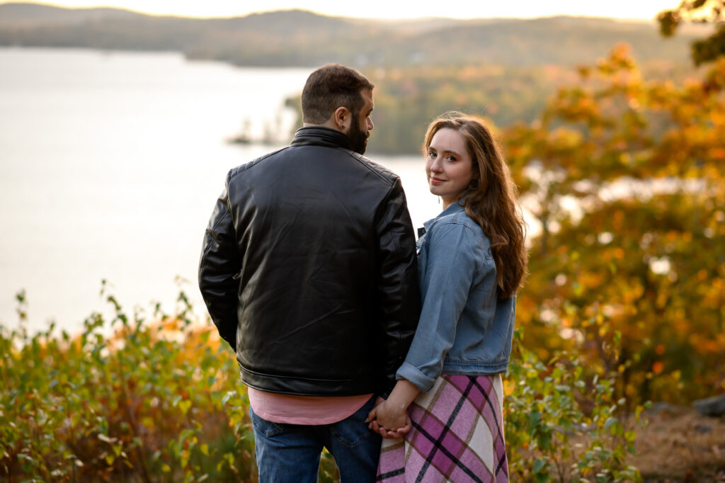 Portrait of couple with mountain and lake backdrop in Sunapee