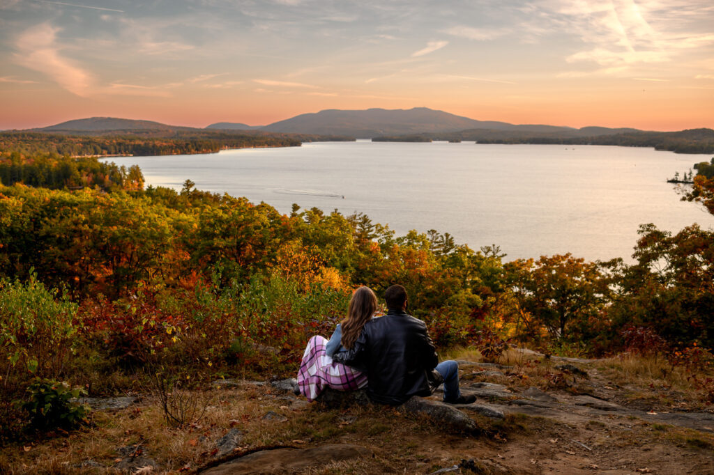 Scenic wide shot of couple at Sunapee overlook