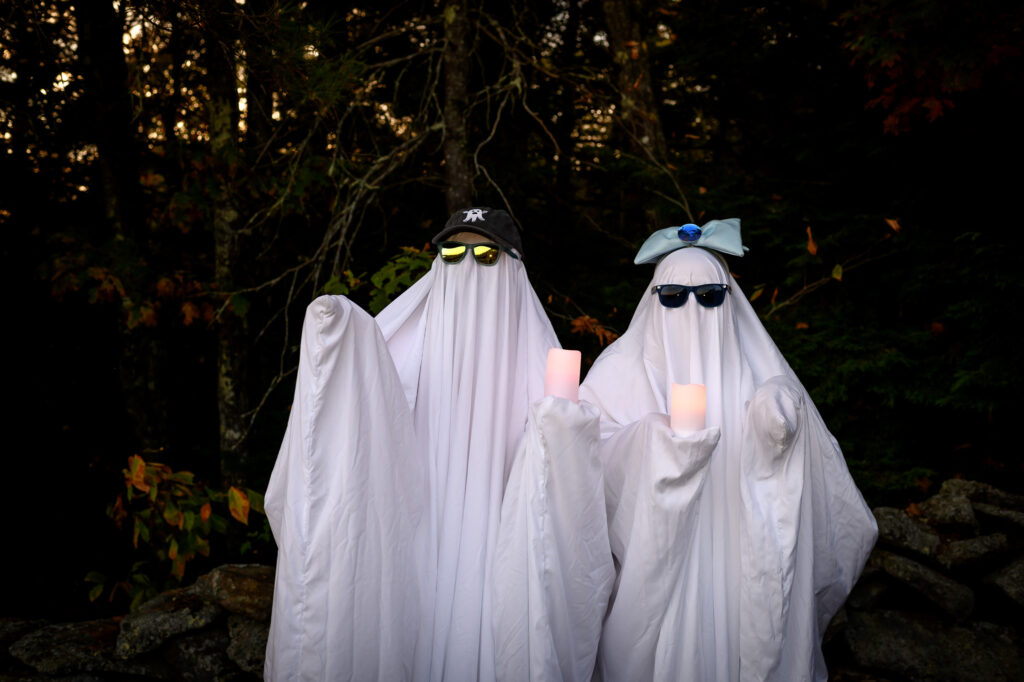 Playful ghost photo idea during Lake Sunapee engagement session